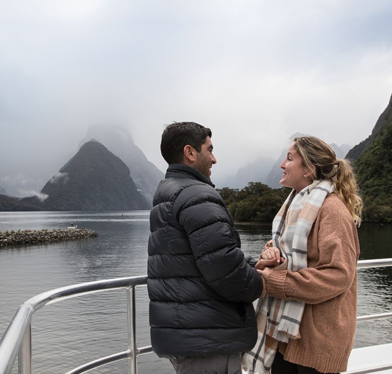 Couple enjoying stunning views of Milford Sound